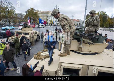 (151024) -- VILNIUS, Oct. 24, 2015 -- A child talks with soldiers from the 173rd Airborne Brigade of the U.S. in Vilnius, Lithuania, Oct. 24, 2015. U.S. started sending rotational forces to Lithuania since spring of 2014, and jointly attended exercises with troops of Lithuania as well as from other NATO allies. ) LITHUANIA-VILNIUS-U.S.-MILITARY AlfredasxPliadis PUBLICATIONxNOTxINxCHN   Vilnius OCT 24 2015 a Child Talks With Soldiers from The 173rd Airborne Brigade of The U S in Vilnius Lithuania OCT 24 2015 U S started sending rotational Forces to Lithuania Since Spring of 2014 and jointly att Stock Photo