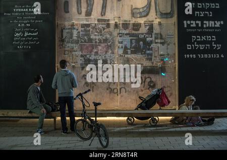 (151105) -- TEL AVIV, Nov. 4, 2015 -- People look at the photos of former Israeli Prime Minister Yitzhak Rabin at the site where he was assassinated, at the 20th anniversary of the assassination of Yitzhak Rabin, near the Rabin Square in Tel Aviv, Israel, Nov. 4, 2015. Rabin was assassinated on Nov. 4, 1995, at the end of a rally in support of the Oslo Accords at the Kings of Israel Square in Tel Aviv. ) ISRAEL-TEL AVIV-YITZHAK RABIN-ASSASSINATION-20TH ANNIVERSARY LixRui PUBLICATIONxNOTxINxCHN Gedenken an Jitzchak Rabin in Tel Aviv   Tel Aviv Nov 4 2015 Celebrities Look AT The Photos of Former Stock Photo