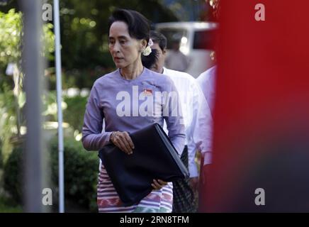 (151105) -- YANGON, Nov. 5, 2015 -- Chairperson of the National League for Democracy (NLD) Aung San Suu Kyi walks out from her residence before a press conference in Yangon, Myanmar, Nov. 5, 2015. Myanmar opposition leader Aung San Suu Kyi vowed to give priority to national reconciliation work and peace efforts if winning the general election set for Nov. 8.) MYANMAR-YANGON-AUNG SAN SUU KYI-GENERAL ELECTION-PRESS CONFERENCE UxAung PUBLICATIONxNOTxINxCHN   Yangon Nov 5 2015 Chair person of The National League for Democracy NLD Aung San Suu Kyi Walks out from her Residence Before a Press Confere Stock Photo