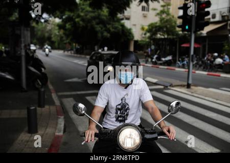 (151105) -- JERUSALEM, Nov. 5, 2015 -- An Israeli man wears a mask in dust storm while he rides a scooter in Tel Aviv, Israel, on Nov. 5, 2015. All take offs were suspended at Ben Gurion Airport due to weather conditions on Thursday afternoon and dust storms cast influence across most of the country. Eilat and?Sde Dov airports?were shut down due to weather conditions on Wedensday. /Daniel Bar-On) ISRAEL-TEL AVIV-WEATHER-DUST STORM JINI PUBLICATIONxNOTxINxCHN Sandsturm in Tel Aviv   Jerusalem Nov 5 2015 to Israeli Man Wears a Mask in Dust Storm while he Rides a Scooter in Tel Aviv Israel ON Nov Stock Photo