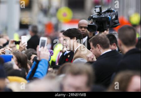 (151111) -- OTTAWA, Nov. 11, 2015 -- Canadian Prime Minister Justin Trudeau greets spectators during Remembrance Day ceremonies at the National War Memorial in Ottawa, Canada, Nov. 11, 2015. ) CANADA-OTTAWA-REMEMBERANCE DAY ChrisxRoussakis PUBLICATIONxNOTxINxCHN   151111 Ottawa Nov 11 2015 Canadian Prime Ministers Justin Trudeau greets spectators during Remembrance Day Ceremonies AT The National was Memorial in Ottawa Canada Nov 11 2015 Canada Ottawa Rememberance Day  PUBLICATIONxNOTxINxCHN Stock Photo