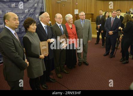 NEW YORK,  China s Permanent Representative to the United Nations Liu Jieyi (4th L), Chinese Consul General to New York Zhang Qiyue (2nd L), Rabbi Arthur Schneier (3rd L) attend the premiere at the Park East Synagogue in New York, the United States, Nov. 16, 2015. The documentary Survival in Shanghai recalls the history of over 20,000 Jews escaping to Shanghai, east China, during the Second World War. ) U.S.-NEW YORK-PREMIERE-SURVIVAL IN SHANGHAI WangxLei PUBLICATIONxNOTxINxCHN   New York China S permanently Representative to The United Nations Liu Jieyi 4th l Chinese Consul General to New Yor Stock Photo