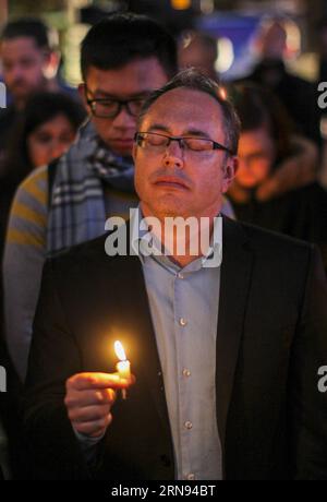 People holding candles take part in a memorial service for the victims of last Friday s attacks in Paris, in front of the City Hall of Los Angeles, the United States, on Nov. 17, 2015. ) US-LOS ANGELES-MEMORIAL-PARIS ATTACKS ZhaoxHanrong PUBLICATIONxNOTxINxCHN   Celebrities Holding Candles Take Part in a Memorial Service for The Victims of Load Friday S Attacks in Paris in Front of The City Hall of Los Angeles The United States ON Nov 17 2015 U.S. Los Angeles Memorial Paris Attacks ZhaoxHanrong PUBLICATIONxNOTxINxCHN Stock Photo