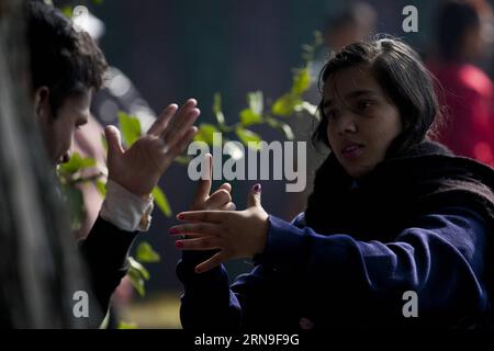 KATHMANDU, Dec. 3, 2015 -- A girl communicates with her friend in sign language on the 24th International Day of Persons with Disabilities in Kathmandu, Nepal, Dec. 3, 2015. The day is celebrated under the theme of Inclusion matters: access and empowerment for people of all abilities worldwide this year. ) NEPAL-KATHMANDU-INTERNATIONAL DAY OF PERSONS WITH DISABILITIES PratapxThapa PUBLICATIONxNOTxINxCHN   Kathmandu DEC 3 2015 a Girl communicate With her Friend in Sign Language ON The 24th International Day of Persons With Disabilities in Kathmandu Nepal DEC 3 2015 The Day IS celebrated Under T Stock Photo