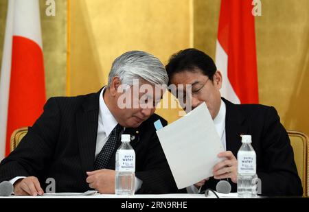 (151217) -- TOKYO, Dec. 17, 2015 -- Japanese Foreign Minister Fumio Kishida (R) talks with Japanese Defense Minister Gen Nakatani during a joint press conference after the 1st 2+2 talks involving foreign and defense ministers of Japan and Indonesia, in Tokyo, capital of Japan, on Dec. 17, 2015. Japan and Indonesia on Thursday agreed to boost cooperation in defense equipment and technologies transfer during their first two plus two talks here involving foreign and defense ministers of the two countries. ) JAPAN-TOKYO-INDONESIA-1ST 2+2 TALKS MaxPing PUBLICATIONxNOTxINxCHN   151217 Tokyo DEC 17 2 Stock Photo