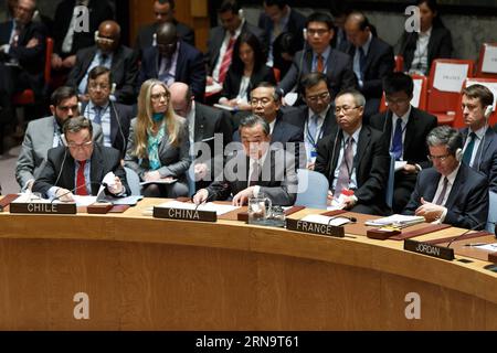 UN Sicherheitsrat billigt Friedensplan für Syrien (151218) -- NEW YORK, Dec. 18, 2015 -- Chinese Foreign Minister Wang Yi (C, front) speaks during a United Nations Security Council meeting on Syria at the UN headquarters in New York, Dec. 18, 2015. The UN Security Council on Friday adopted a resolution endorsing an international roadmap for a Syrian-led political transition in order to end the country s conflict, which calls for Syria peace talks to begin in early January. ) UN-SECURITY COUNCIL-SYRIA-ROADMAP-CHINA-WANG YI LixMuzi PUBLICATIONxNOTxINxCHN   UN Security Council approves  Peace pla Stock Photo