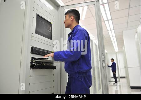 Technicial personnels work at Lancangjiang transformer substation in Chengdu, capital of southwest China s Sichuan Province, August 1, 2015. China s economy grew by 6.9 percent in 2015.  wf CHINA-GDP GROWTH-6.9 PERCENT CN LiuxKun PUBLICATIONxNOTxINxCHN Stock Photo