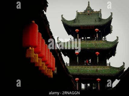 (160125) -- BEIJING, Jan. 25, 2016 -- Lanterns are hung on buildings in Langzhong ancient village, southwest China s Sichuan Province, Nov. 15, 2014. Lanterns in China have a long history and they have become synonymous with Chinese culture. Even today, they are still made and enjoyed by the Chinese worldwide. They were used as a means of artistic expression, in terms of functionality, design and decoration. Chinese streets in both cities and towns are decorated with red lanterns during festivals, especially Chinese Lunar New Year, Mid-Autumn Festival and Lantern Festival. ) (zkr) CHINA-LANTER Stock Photo