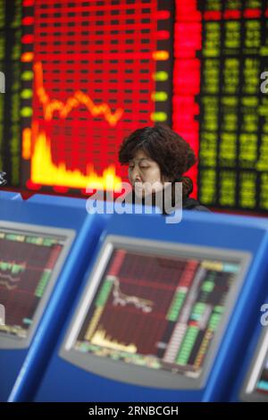 (160229) -- HUAIBEI, Feb. 29, 2016 -- An investor looks through stock information at a trading hall in Huaibei, east China s Anhui Province, Feb. 29, 2016. Chinese shares dived below the 2,700-point mark on Monday, ending February at their lowest ebb in the month. The benchmark Shanghai Composite Index plunged 2.86 percent to close at 2,687.98 points while the smaller Shenzhen index declined 4.98 percent to end the day at 9,097.36 points. ) (wyo) CHINA-STOCK-DOWNTURN (CN) XiexZhengyi PUBLICATIONxNOTxINxCHN   Huaibei Feb 29 2016 to Investor Looks Through Stick Information AT a Trading Hall in H Stock Photo