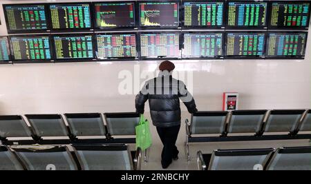 (160229) -- NANTONG, Feb. 29, 2016 -- An investor looks through stock information at a trading hall in Nantong, east China s Jiangsu Province, Feb. 29, 2016. Chinese shares dived below the 2,700-point mark on Monday, ending February at their lowest ebb in the month. The benchmark Shanghai Composite Index plunged 2.86 percent to close at 2,687.98 points while the smaller Shenzhen index declined 4.98 percent to end the day at 9,097.36 points. ) (wyo) CHINA-STOCK-DOWNTURN (CN) XuxCongjun PUBLICATIONxNOTxINxCHN   Nantong Feb 29 2016 to Investor Looks Through Stick Information AT a Trading Hall in Stock Photo