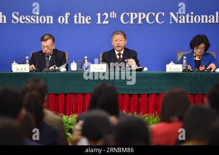 (160309) -- BEIJING, March 9, 2016 -- Fan Xiaojian (C), a member of the 12th National Committee of the Chinese People s Political Consultative Conference, answers questions during a press conference on the development of people s livelihood in Beijing, capital of China, March 9, 2016. )(mcg) (TWO SESSIONS)CHINA-BEIJING-CPPCC-PRESS CONFERENCE (CN) LixXin PUBLICATIONxNOTxINxCHN   Beijing March 9 2016 supporter Xiaojian C a member of The 12th National Committee of The Chinese Celebrities S Political Consultative Conference Answers Questions during a Press Conference ON The Development of Celebrit Stock Photo