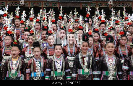 (160320) -- QIANDONGNAN, March 19, 2016 -- Girls wearing traditional costumes of Dong ethnic group sing songs in Zaima Township of Rongjiang County, southwest China s Guizhou Province, March 19, 2016. Rongjiang County in Guizhou has long been the habitat for ethnic minorities of Dong, Miao, Shui and Yao people, each boasts of their peculiar costume. ) (zwx) CHINA-GUIZHOU-RONGJIANG-COSTUMES OF ETHNIC MINORITIES(CN) YangxChengli PUBLICATIONxNOTxINxCHN   Qiandongnan March 19 2016 Girls Wearing Traditional Costumes of Dong Ethnic Group Sing Songs in  Township of Rongjiang County Southwest China S Stock Photo