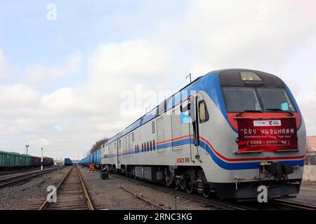 (160321) -- DOSTYK, March 20, 2016 -- The Chang an cargo train is about to leave the train station at the town of Dostyk, Kazakhstan, March 20, 2016. The Chang an cargo train hauling 2,000 tons of goods from Kazakhstan left for China on Sunday, for the first time after the start of its operation since November, 2013. It is expected to arrive at its destination Xi an, capital of northwest China s Shaanxi Province, in five days. In the past two years it has been transporting exported Chinese goods to central Asian countries along the Silk Road Economic Belt and returning China empty-loaded for m Stock Photo