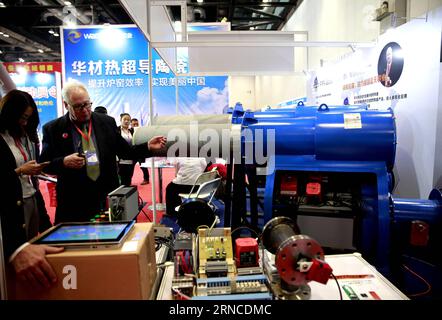 (160406) -- BEIJING, April 6, 2016 -- Visitors get to know the superconductive ceramics for improving the efficiency of furnaces at the Eighth China Low Carbon Industry Exhibition held in Beijing, China, April 6, 2016. The 3-day event attracted nearly a thousand enterprises and some 5000 products with new technology, focusing the low carbon industry. ) (zhs) CHINA-BEIJING-EXHIBITION-LOW CARBON (CN) PanxXu PUBLICATIONxNOTxINxCHN   Beijing April 6 2016 Visitors Get to Know The superconductive Ceramics for improving The Efficiency of Furnaces AT The Eighth China Low Carbon Industry Exhibition Her Stock Photo