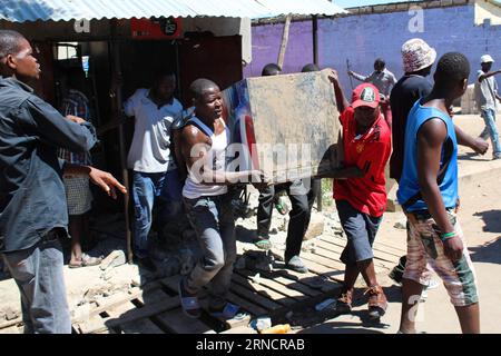 (160419) -- LUSAKA, April 19, 2016 -- Residents loot a shop in Bauleni township in Lusaka, capital of Zambia, April 19, 2016. Attacks on foreign owned shops in Lusaka, the Zambian capital have spread to other parts of the city with more shops attacked. The attacks started in the morning in two sprawling shanty compounds over rumors that foreigners were behind a spate of suspected ritual killings that have occurred in recent weeks. So far, over 250 people have been arrested in connection with the looting of shops owned by Rwandan nationals while the number of looted shops stands at 65, accordin Stock Photo