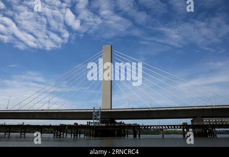 (160419) -- DAR ES SALAAM, April 19, 2016 -- A part of the Kigamboni Bridge is seen in Dar es Salaam, Tanzania, on April 19, 2016. Tanzania s new 135-million-US-dollar bridge connecting Kigamboni and Kurasini in the east African nation s commercial capital Dar es Salaam, has left an indelible mark to local engineers. The project undertaken by China Railway Construction Engineering Group (CRCEG) in a joint venture with China Railway Major Bridge Group (CRMBG) was officially inaugurated by President John Magufuli on Tuesday. The 32-metre wide bridge has six lanes, three in each direction, and tw Stock Photo