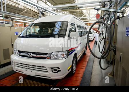 (160419) -- JOHANNESBURG, April 19, 2016 -- A worker walks past a bus at the automobile plant of Beijing Automobile Works Co., Ltd (BAW), known as BAW?South?Africa in Springs, west of Johannesburg, on April 19, 2016. The Industrial Development Corporation (IDC), a South?African state-run financial institution, pledged on Tuesday to financially support a joint venture with the BAW. ) SOUTH AFRICA-SPRINGS-CHINA-AUTOMOBILE-COOPERATION ZhaixJianlan PUBLICATIONxNOTxINxCHN   160419 Johannesburg April 19 2016 a Worker Walks Past a Bus AT The Automobiles plant of Beijing Automobiles Works Co Ltd Baw k Stock Photo