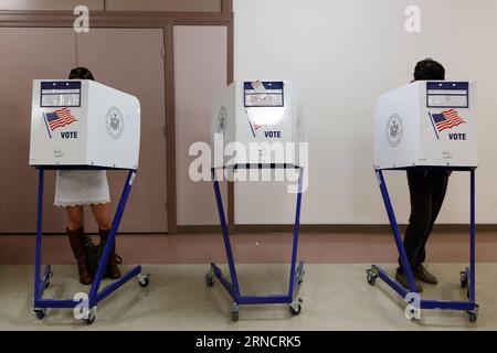 NEW YORK, April 19, 2016 -- Voters fill in their ballots at a polling station in Manhattan, New York, the United States, April 19, 2016. New Yorkers lined up to vote on Tuesday in crucial presiential primaries in a state where both Democratic hopefuls, Hillary Clinton and Bernie Sanders, and Republican front-runner Donald Trump have roots.  U.S.-NEW YORK-PRESIDENTIAL PRIMARY-VOTE LixMuzi PUBLICATIONxNOTxINxCHN Stock Photo