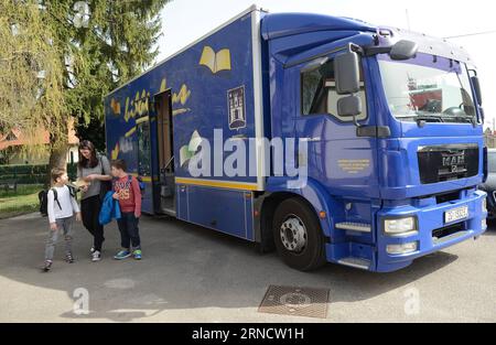 ZAGREB, April 06, 2016 -- A mother and her kids borrow books from a Bibliobus mobile library in Gracani near Zagreb, capital of Croatia, April 6, 2016. The Bibliobus is a mobile library service organized by Zagreb City Library, covering 78 points in the city and its surrounding. ) CROATIA-ZAGREB-MOBILE LIBRARY SERVICE MisoxLisanin PUBLICATIONxNOTxINxCHN   Zagreb April 06 2016 a Mother and her Kids borrow Books from a  Mobile Library in Gracani Near Zagreb Capital of Croatia April 6 2016 The  IS a Mobile Library Service Organized by Zagreb City Library covering 78 Points in The City and its sur Stock Photo