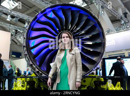 Hannover Messe (160425) -- HANOVER, April 25, 2016 -- A visitor poses for photos with a machine model at Microsoft s stand at the 2016 Hanover industrial trade fair in Hanover, Germany, on April 25, 2016. More than 5,200 exhibitors from over 70 countries and regions attended the fair. ) GERMANY-HANOVER-INDUSTRIAL TRADE FAIR ZhangxFan PUBLICATIONxNOTxINxCHN   Hanover trade Fair 160425 Hanover April 25 2016 a Visitor Poses for Photos With a Machine Model AT Microsoft S stand AT The 2016 Hanover Industrial Trade Fair in Hanover Germany ON April 25 2016 More than 5 200 exhibitors from Over 70 Coun Stock Photo