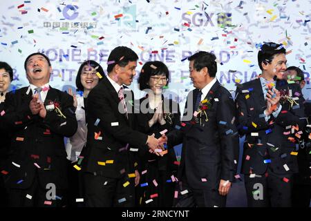 (160425) -- SINGAPORE, April 25, 2016 -- Singapore s Minister in Prime Minister s Office Chan Chun Sing (L, center) and Chairman of China Construction Bank (CCB) Wang Hongzhang (R, center) shake hands during the signing ceremony of Memorandum of Understanding (MoU) held in Singapore, April 25, 2016. The CCB and International Enterprise (IE) Singapore signed a MOU on Monday, in which CCB will provide 30 billion Singapore dollars (22.2 billion U.S. dollars) of financing services to support enterprises on infrastructure projects under the Belt and Road Initiative. ) SINGAPORE-CHINA CONSTRUCTION B Stock Photo