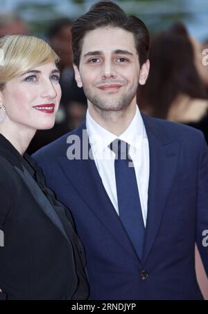 69. Festival de Cannes: Abschlussfeier (160522) -- CANNES, May 22, 2016 -- Canadian director Xavier Dolan and Nancy Grant (R) poses as he arrives at the closing ceremony of the 69th Cannes Film Festival in Cannes, France, May 22, 2016. ) FRANCE-CANNES-FILM FESTIVAL-CLOSING CEREMONY-RED CARPET JinxYu PUBLICATIONxNOTxINxCHN   69 Festival de Cannes Closing Ceremony 160522 Cannes May 22 2016 Canadian Director Xavier Dolan and Nancy Grant r Poses As he arrives AT The CLOSING Ceremony of The 69th Cannes Film Festival in Cannes France May 22 2016 France Cannes Film Festival CLOSING Ceremony Red Carpe Stock Photo