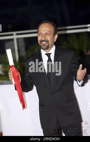 (160522) -- CANNES, May 22, 2016 -- Director Asghar Farhadi, Best Screenplay Award winner for the film Forushande (The Salesman), poses during a photocall after the closing ceremony of the 69th Cannes Film Festival in Cannes, France, May 22, 2016. ) FRANCE-CANNES-FILM FESTIVAL-AWARD-PHOTOCALL JinxYu PUBLICATIONxNOTxINxCHN   160522 Cannes May 22 2016 Director Asghar Farhadi Best Screenplay Award Winner for The Film Forushande The Salesman Poses during a photo call After The CLOSING Ceremony of The 69th Cannes Film Festival in Cannes France May 22 2016 France Cannes Film Festival Award photo cal Stock Photo