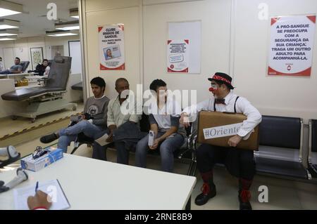 (160614) -- SAO PAULO, June 14, 2016 -- Image taken on June 9, 2016, shows Gilberto Kido (C), 50, talking to other blood donors in the waiting room at the Pro Sangre Foundation in Sao Paulo, Brazil. Gilberto Kido has been a voluntary blood donor for the last 30 years after his mother died while waiting for a kidney transplant. Using his clown character, Kido has an objective to encourage the blood donation for saving lives. The World Blood Donor Day is celebrated every year on June 14. In 2016 the theme of the campaign is Blood connects us all , the World Health Organization (WHO) has also ado Stock Photo