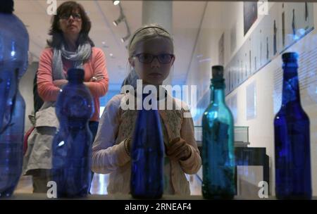 (160616) -- FRANKFURT, June 16, 2016 -- A girl visits the exhibition of drift bottles collected by German artist Joachim Romer in the museum for communication in Frankfurt, Germany, on June 15, 2016. The exhibition is held from June 15 to Sept. 4, 2016. More than 200 drift bottles and messages in them will be presented during the exhibition. ) GERMANY-FRANKFURT-DRIFT BOTTLES EXHIBITION LuoxHuanhuan PUBLICATIONxNOTxINxCHN   160616 Frankfurt June 16 2016 a Girl visits The Exhibition of Drift Bottles collected by German Artist Joachim Romer in The Museum for Communication in Frankfurt Germany ON Stock Photo