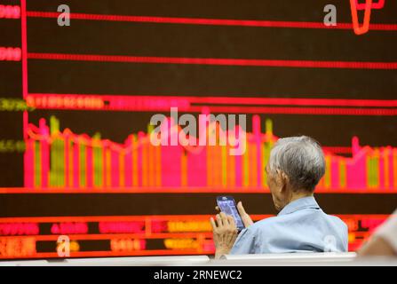 (160705) -- BEIJING, July 5, 2016 () -- An investor stays at a stock trading hall in Beijing, capital of China, July 5, 2016. Chinese stocks closed mixed on Tuesday, with the benchmark Shanghai Composite Index up 0.6 percent, at 3,006.39 points. The smaller Shenzhen index closed 0.07 percent lower at 10,602.77 points. () (wx) CHINA-STOCK-MIXED CLOSING (CN) xinhua PUBLICATIONxNOTxINxCHN   160705 Beijing July 5 2016 to Investor stays AT a Stick Trading Hall in Beijing Capital of China July 5 2016 Chinese Stocks Closed Mixed ON Tuesday With The Benchmark Shanghai Composite Index up 0 6 percent AT Stock Photo