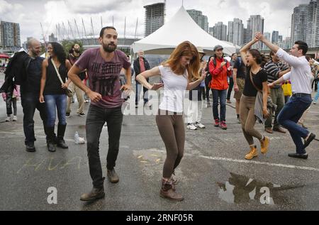 (160710) -- VANCOUVER, July 10, 2016 -- Residents dance during the Carnaval del Sol event in Vancouver, Canada, July 9, 2016. The event showcases and celebrates Latin American culture via different activities that aimed to build bridges of understanding with other communities. Liang sen) CANADA-VANCOUVER-CARNAVAL DEL SOL HarrisonxHa PUBLICATIONxNOTxINxCHN   Vancouver July 10 2016 Residents Dance during The Carnaval Del Sol Event in Vancouver Canada July 9 2016 The Event showcases and celebrates Latin American Culture Via different Activities Thatcher aimed to BUILD Bridges of Understanding Wit Stock Photo