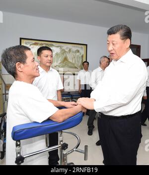 TANGSHAN, July 28, 2016 -- Chinese President Xi Jinping (R front), who is also general secretary of the Communist Party of China (CPC) Central Committee and chairman of the Central Military Commission (CMC), talks with a paraplegic patient at the city s paraplegic rehabilitation center in Tangshan, north China s Hebei Province, July 28, 2016. )(wjq) CHINA-HEBEI-TANGSHAN-XI JINPING-INSPECTION (CN) XiexHuanchi PUBLICATIONxNOTxINxCHN   Tang Shan July 28 2016 Chinese President Xi Jinping r Front Who IS Thus General Secretary of The Communist Party of China CPC Central Committee and Chairman of The Stock Photo