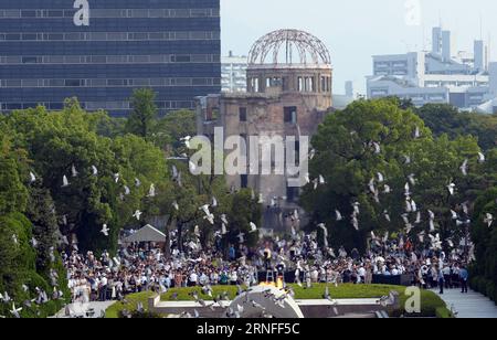 (160806) -- HIROSHIMA, Aug. 6, 2016 -- Pigeons fly above the Peace Momorial Park in Hiroshima, Japan, on Aug. 6, 2016. Hiroshima, the city that suffered U.S. atomic bombing in 1945 during World War II, commemorated the 71st anniversary of the bombing on Saturday at the city s Peace Memorial Park. ) (syq) JAPAN-HIROSHIMA-ATOMIC BOMBING-71ST ANNIVERSARY-COMMEMORATION MaxPing PUBLICATIONxNOTxINxCHN   Hiroshima Aug 6 2016 pigeons Fly above The Peace Momorial Park in Hiroshima Japan ON Aug 6 2016 Hiroshima The City Thatcher suffered U S Atomic Bombing in 1945 during World was II commemorated The 71 Stock Photo