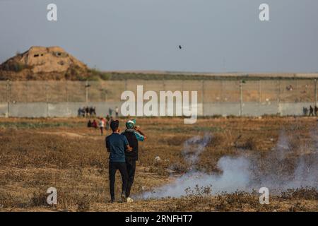 Gaza, Gaza, Palestine. 1st Sep, 2023. A Palestinian man looks at a tear gas canister when it falls next to him (Credit Image: © Saher Alghorra/ZUMA Press Wire) EDITORIAL USAGE ONLY! Not for Commercial USAGE! Stock Photo