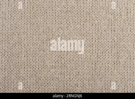 Texture de tissu tricoté fait main beige à partir de fil angora Banque D'Images