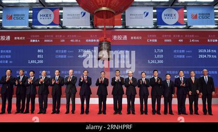 (161205) -- SHENZHEN, Dec. 5, 2016 () -- Hu Chunhua (8th L), a member of the Political Bureau of the Communist Party of China (CPC) Central Committee and secretary of the Guangdong Provincial CPC Committee, and Liu Shiyu (7th L), chairman of the China Securities Regulatory Commission, attend a launching ceremony of the Shenzhen-Hong Kong Stock Connect in Shenzhen, south China s Guangdong Province, Dec. 5, 2016. The Shenzhen-Hong Kong Stock Connect, the second link between bourses in the Chinese mainland and Hong Kong, made a debut on Monday. () (wx) CHINA-SHENZHEN-HONG KONG-STOCK CONNECT-LAUNC Stock Photo