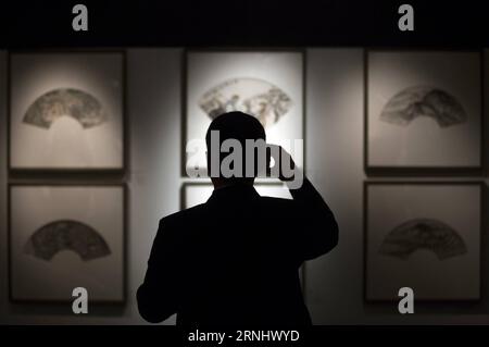 (161215) -- BUENOS AIRES, Dec. 15, 2016 -- Image taken on Dec. 13, 2016 shows a man taking a photo of the works displayed during the exhibition Chinese Style: Selected works from the China National Academy of Painting , in the National Museum of Decorative Arts (MNAD) in Buenos Aires, Argentina. An exhibition of traditional Chinese hand-painted fans was opened to the public here on Wednesday. )(da)(fnc)(yk) ARGENTINA-BUENOS AIRES-CHINA-CULTURE-EXHIBITION MARTINxZABALA PUBLICATIONxNOTxINxCHN   161215 Buenos Aires DEC 15 2016 Image Taken ON DEC 13 2016 Shows a Man Taking a Photo of The Works dis Stock Photo