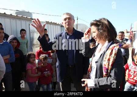 (190310) -- BEYROUTH, 10 mars 2019 (Xinhua) -- Filippo grandi (L, front), Haut Commissaire des Nations Unies pour les réfugiés, visite un camp de réfugiés syriens dans le nord du Liban, Akkar, le 9 mars 2019. Filippo grandi a déclaré vendredi que son agence travaillait avec les autorités syriennes pour lever les obstacles au retour des réfugiés syriens dans leur patrie, ont rapporté les médias locaux. Plus de 1 millions de réfugiés syriens se sont enregistrés auprès du HCR au Liban, tandis que le gouvernement estime le nombre réel de Syriens au Liban à 1,5 millions. (XINHUA/KHALID) LIBAN-RÉFUGIÉS SYRIENS-AGENCE DES NATIONS UNIES POUR LES RÉFUGIÉS Banque D'Images