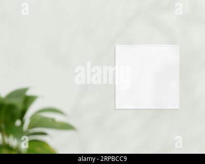 Maquette de cadre blanc carré sur le mur blanc. Maquette d'affiche. Propre, moderne, cadre minimal. Cadre vide intérieur intérieur, afficher le texte ou le produit. maquette de cadre Banque D'Images