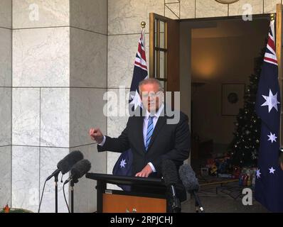 191205 -- CANBERRA, le 5 décembre 2019 -- le Premier ministre australien Scott Morrison assiste à une conférence de presse au Parlement à Canberra, en Australie, le 5 décembre 2019. Le Premier ministre australien Scott Morrison a annoncé la plus grande refonte de la fonction publique nationale depuis des décennies. Morrison a déclaré aux journalistes à Canberra jeudi que sa décision de réduire le nombre de ministères du gouvernement de 18 à 14 à partir du 1 février réduirait la congestion bureaucratique et améliorerait la prise de décision. AUSTRALIA-CANBERRA-PM-PRESS CONFERENCE BaixXu PUBLICATIONxNOTxINxCHN Banque D'Images