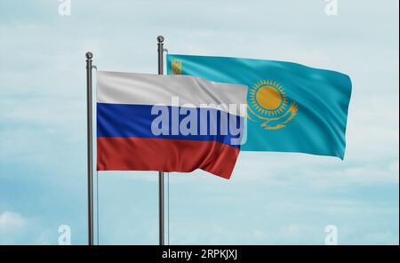 Drapeau du Kazakhstan et de la Russie agitant ensemble dans le vent sur le ciel bleu, concept de coopération de deux pays Banque D'Images