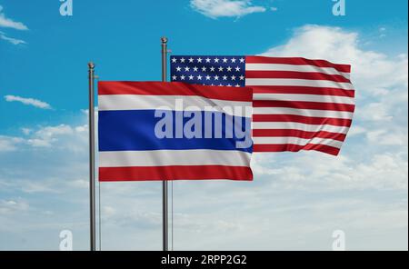 Drapeau des États-Unis et de la Thaïlande agitant ensemble dans le vent sur le ciel bleu, concept de coopération de deux pays Banque D'Images
