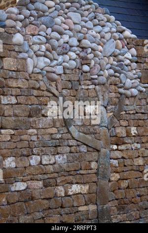 Stone Tree moulé dans le crochet de mur de pierre Norton Cotswolds Oxfordshire Angleterre royaume-uni Banque D'Images