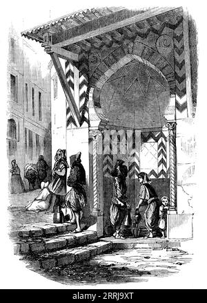 Fontaine mauresque, Alger, 1858. « Dans toutes les villes mahoméennes, les fontaines sont très nombreuses et pittoresques, et souvent magnifiques. Autour d'eux, des groupes caractéristiques sont toujours assemblés, et les bocaux à eau sont des accessoires très gracieux. A Alger, les transporteurs d'eau professionnels sont les Biskri, une race industrieuse des oasis du Grand Sahara... les rues menant à la Casbah deviennent plus raides en montant, et beaucoup d'entre eux ne sont que des vols de marches, et si étroites que les étages supérieurs en saillie des maisons se rencontrent souvent au-dessus de la rue... [à] la fontaine que nous gravons, qu'une juive dessine W. Banque D'Images