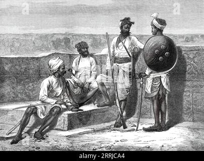 Rajpoots dans leur tenue ordinaire, 1876. Les hommes d'une nation hindoo habitant un vaste pays de l'Inde occidentale, appelé Rajpootana. Ce territoire, d'environ quatre cents milles de large et de long... est divisé en les États indigènes d'Oudeypore ou Meywar, Jodhpore, Jeypore, Bikaneer, et six ou sept de moindre ampleur, dont certains endurent, plutôt que de jouir, un degré d'indépendance. La population totale, inférieure à douze millions, est une émanation de la grande caste militaire hindoo des Kshatriyas ; ils étaient très puissants au XIIe siècle, mais ont cédé la place aux conquérants musulmans du moi Banque D'Images