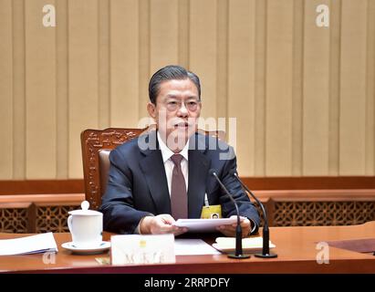 230314 -- BEIJING, le 14 mars 2023 -- Zhao Leji, le président nouvellement élu du Comité permanent de l'Assemblée populaire nationale, préside la première réunion du 14e Comité permanent de l'Assemblée populaire nationale au Grand Hall du peuple à Beijing, capitale de la Chine, le 14 mars 2023. CHINA-BEIJING-NPC-ZHAO LEJI-REUNION CN LIXTAO PUBLICATIONXNOTXINXCHN Banque D'Images