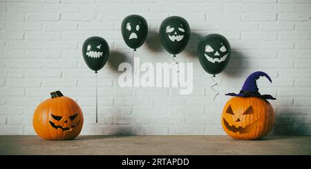 Halloween Pumkin visage et ballons de visage de sourire effrayant, rendu 3D. Banque D'Images