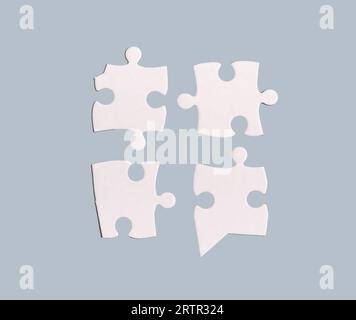 Quatre pièces de puzzle séparées, éléments correspondants, trouver le concept d'équipe Banque D'Images