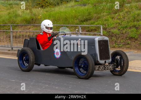 1938 30s Thirties essence 885 cc gris Austin Seven voiture à l'Ocean Speed Revival Southport Sprint sur Marine Drive. Classique et vitesse sur une route publique fermée parcours de sprint historique Coastal Road, Merseyside, Royaume-Uni Banque D'Images