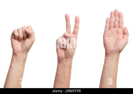 Rock Paper Scissors jeu. Trois mains isolées sur fond blanc Banque D'Images